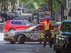 A teen will face court after allegedly driving erratically through a city centre, injuring a woman. (Michael Currie/AAP PHOTOS)