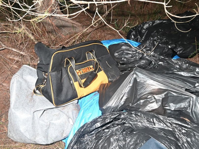 A series of items were found near the bodies. Picture: Court exhibit.