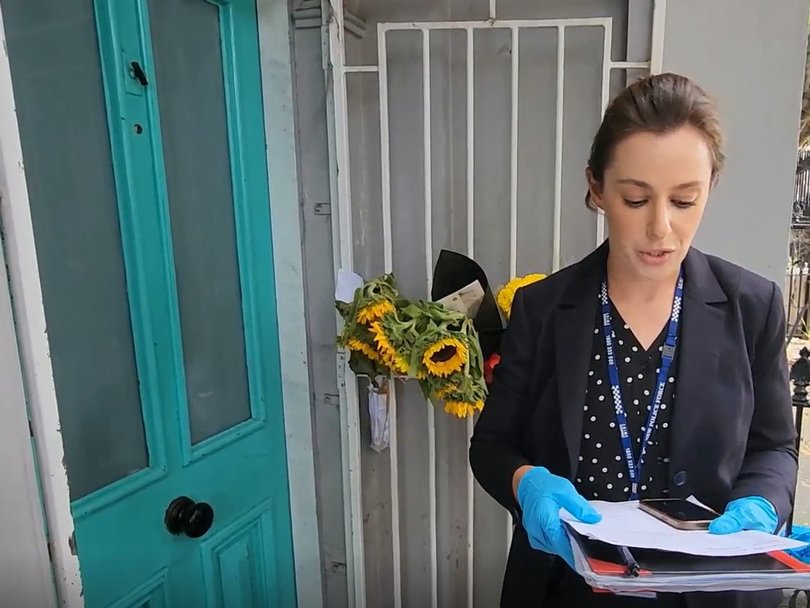 Detective Senior Constable Christine Abela testing the keys that were found at the Greek monastery in the front doors of Jesse Baird's house. Picture: Court exhibit.
