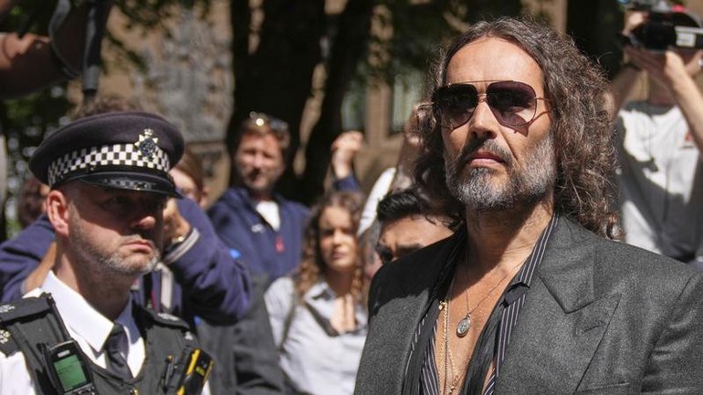 Russell Brand will stand trial for rape and sexual assault in a London court. (AP PHOTO)