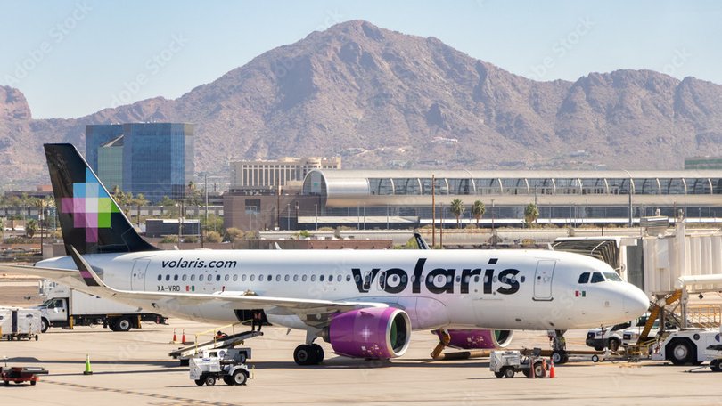 A young woman was found dead in her seat aboard a plane after fellow travellers began disembarking and realised she had not moved.