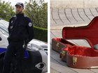 Police have detained a 14-year-old student after two teachers were shot with a gun allegedly smuggled into the school in a guitar case.