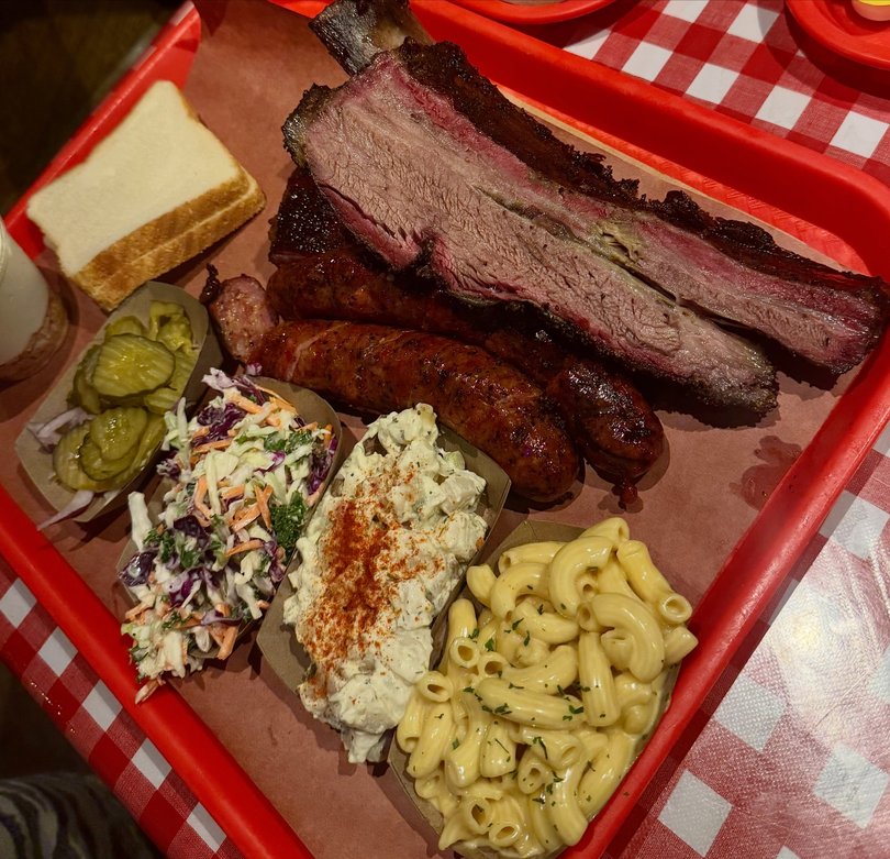 The photos showed Waters enjoying drinks with friends and indulging in some local food, including ribs and macaroni and cheese.