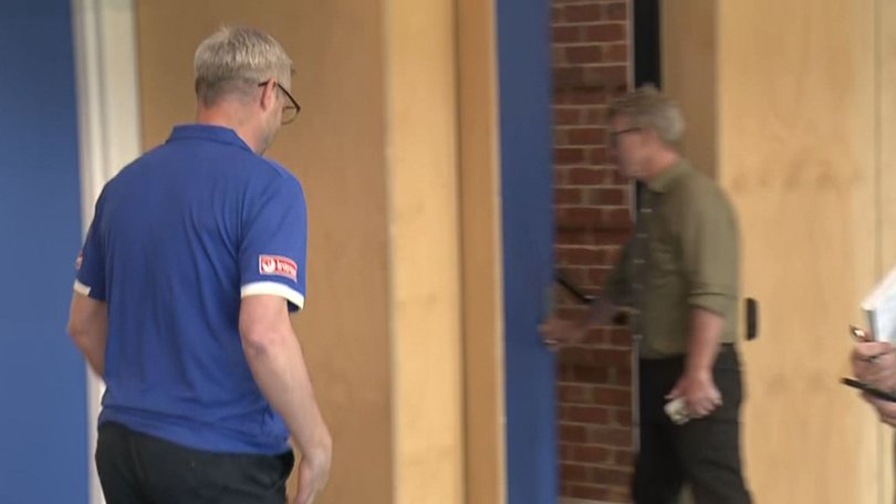 Media boss Mick Tormey (at the door) wasn’t thrilled with the line of questioning on North Melbourne’s acquisition of Nick Blakey.
