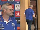 North Melbourne list manager Brady Rawlings walks out of the press conference after journalist’s curly question.