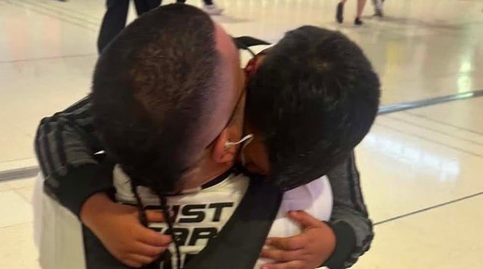 Mr Ramirez pictured with his young son in Sydney airport.