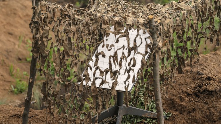  Starlink terminal camouflaged with a net near the eastern frontline in the Donetsk region of Ukraine in the summer of 2023. 