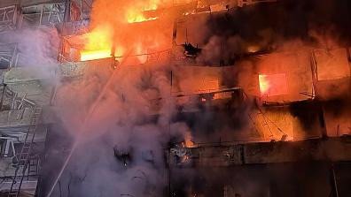 A residential building is engulfed in flames following a Russian attack on October 14, 2026 in Kyiv, Ukraine. 