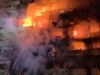 A residential building is engulfed in flames following a Russian attack on October 14, 2026 in Kyiv, Ukraine. 