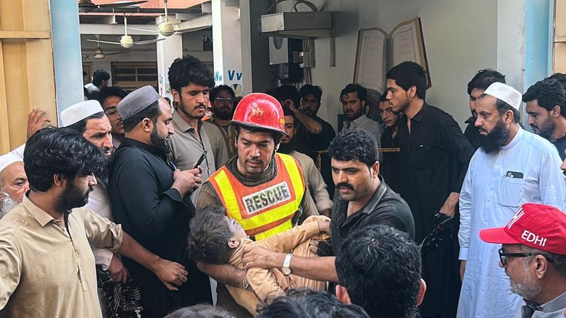 Locals rushed to the school, helping rescuers and frantically looking for children.