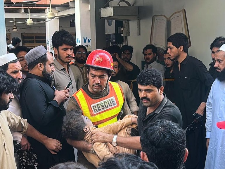 Locals rushed to the school, helping rescuers and frantically looking for children. 