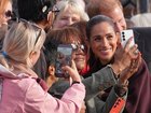 Harry and Meghan posed for selfies with well-wishers during their joint visit to Nottingham. 