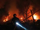 A firefighter at a compound hit by a strike in Kharkiv, northern Ukraine, on October 12, 2026. 