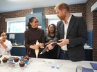 Meghan, Duchess of Sussex and Prince Harry, Duke of Sussex decorate cupcakes at Epic Partners.