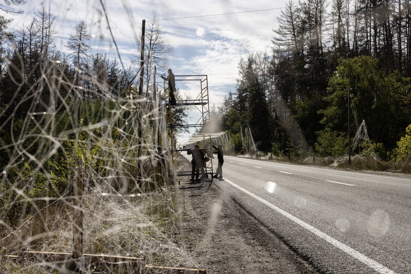 Crews in the Kharkiv region work to install protective netting, which is meant to entangle drones.