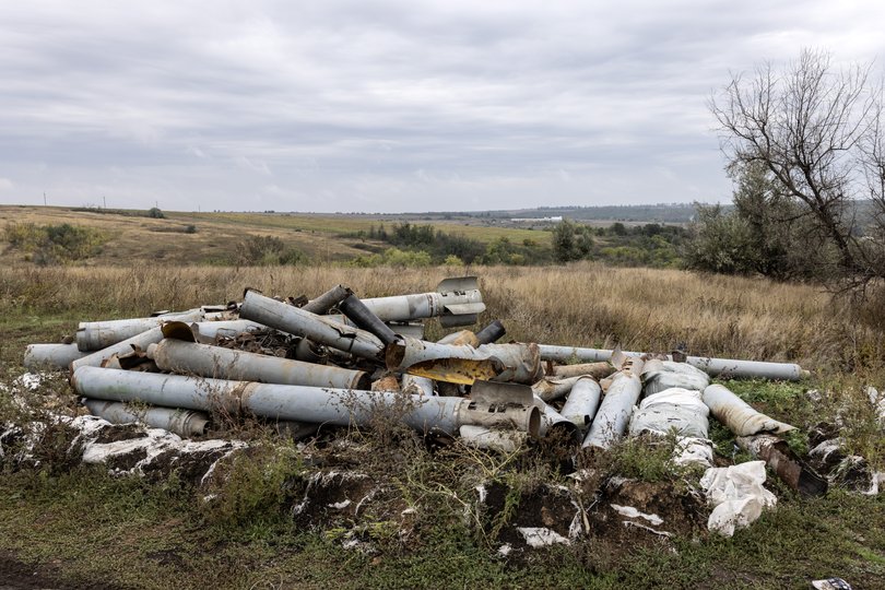 Fragments of Russian missiles and other weapons lie in a field in the Kharkiv region.
