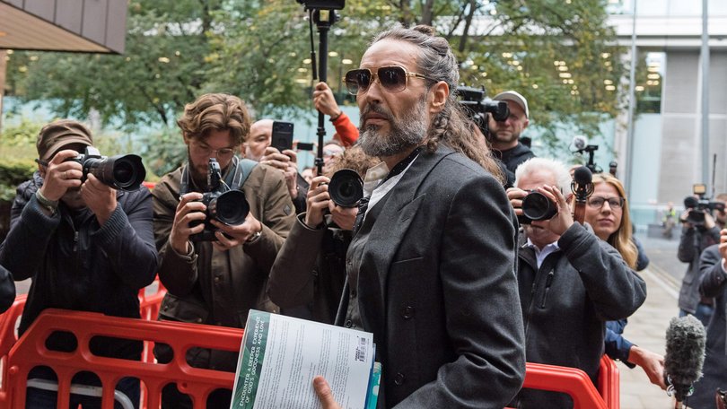 Russell Brand arrives at Southwark Crown Court on the fourth day of his trial.