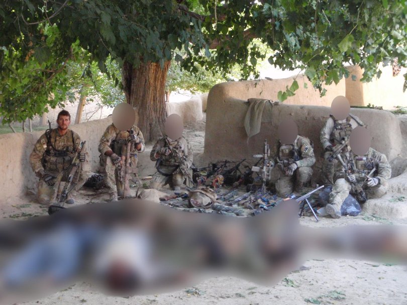 Members of SAS team Epic 1 after the Battle of Tizak on June 11, 2010, in front of Taliban fighters they killed. Corporal Ben Roberts-Smith, on the far left, would be awarded a Victoria Cross for his actions in the battle.
