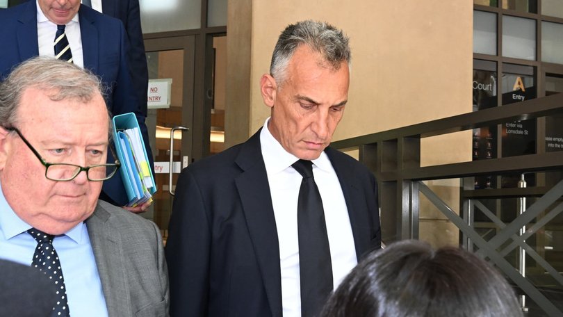 Mr Catalano (centre), attended court with his lawyers. NewsWire / Andrew Henshaw