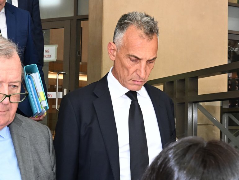 Mr Catalano (centre), attended court with his lawyers. NewsWire / Andrew Henshaw