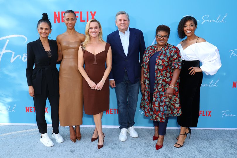 Bela Bajaria on the left with Zoe Saldaña, Reese Witherspoon, Ted Sarandos, Attica Locke, and Tembi Locke at a 2022 Netflix event.
