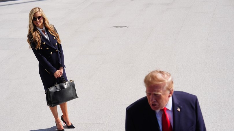President Donald Trump says he told press secretary Katie Zacharia to reconsider her role. (AP PHOTO)