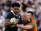 Peter Lakai of the All Blacks is tackled by Isaac Henry of the Wallabies.)