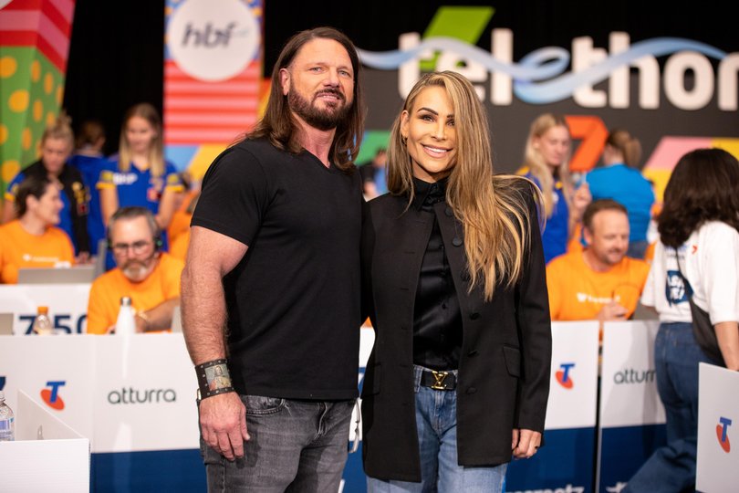WWE superstars AJ Styles and Nattie the Donation Call Centre.
