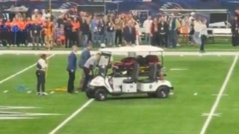 A military service member died after falling hard as he rappelled from the ceiling before a college football game.