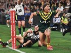 Reece Walsh of Australia reacts following a try-saving tackle on Kiwi counterpart Kalyn Ponga during their clash in the Rugby League World Cup opening game.