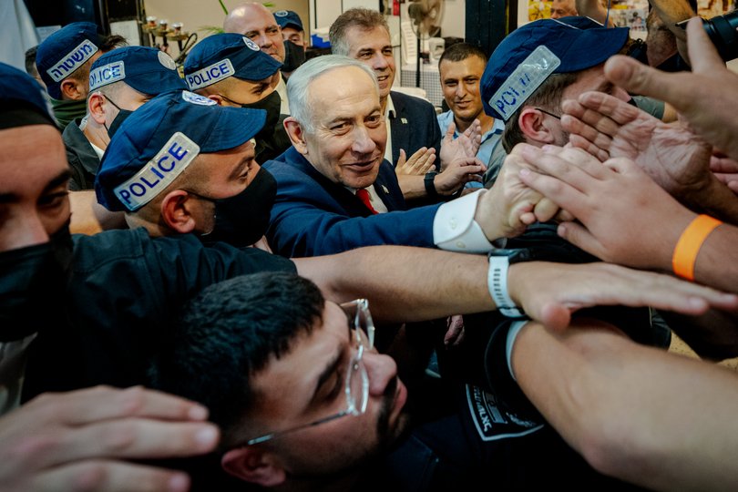Benjamin Netanyahu meets with residents and vendors during an election campaign stop at HaTikva Market in Tel Aviv.