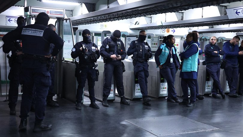 RATP transport security officers inside the closed off Republique Metro station in Paris.
