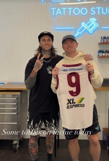 Lachie Neale at a tattoo parlour in Brisbane.