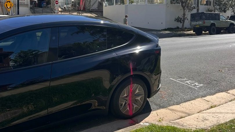 A Tesla driver on the same street also given a spray.