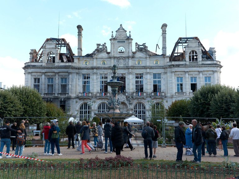 Metal barriers outside the destroyed the City Hall in Limoges Nouvelle-Aquitaine.