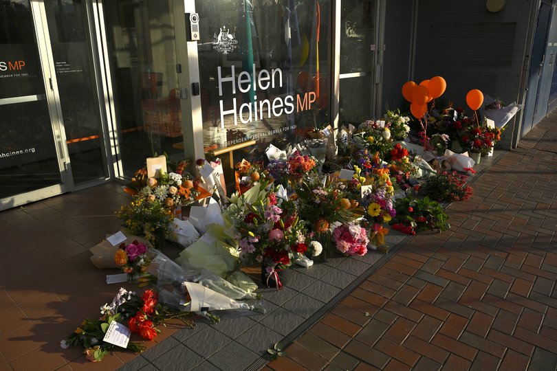 Tributes and flowers are seen for independent federal MP Helen Haines at her electoral office in Wangaratta, Wednesday, October 21, 2026. A man is facing multiple charges over a life-threatening and allegedly targeted attack on independent MP Helen Haines outside her electorate office. (AAP Image/James Ross) NO ARCHIVING