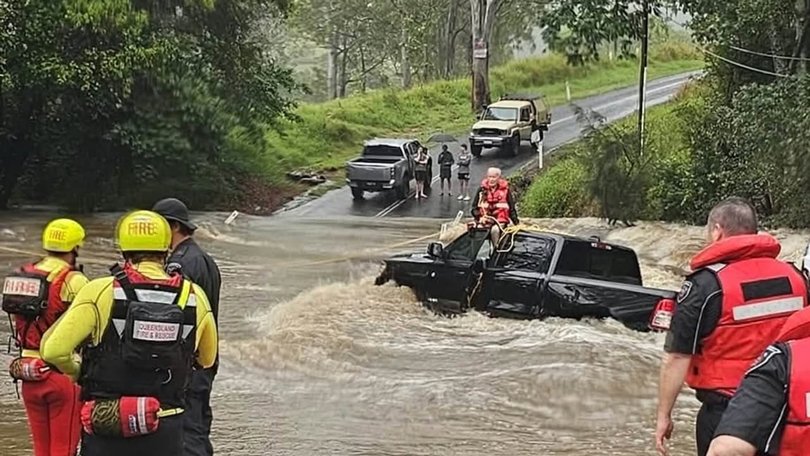 Fire and rescue crews helped save a man trapped in swift water seconds before his car swept away in floodwater. Picture: Facebook/Thomas Hinterdorfer/Extreme Weather Chaser