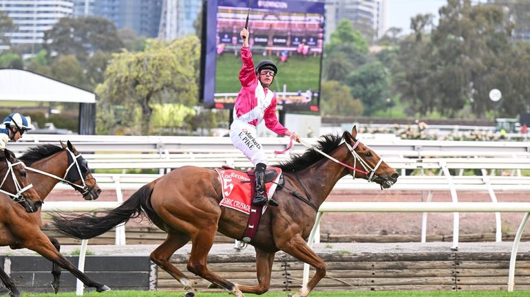 William Pike celebrates after Cosmic Crusader wins the Cox Plate at Flemington.