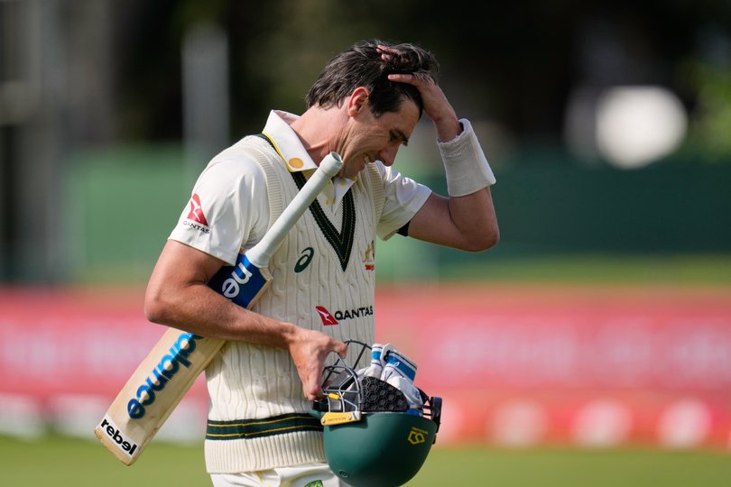 Australia's captain Pat Cummins reacts as he walks off the field after his dismissal on day five.