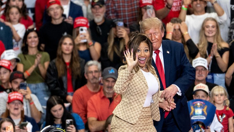 US President Donald Trump greets rapper Nicki Minaj during a campaign event in Port Huron.