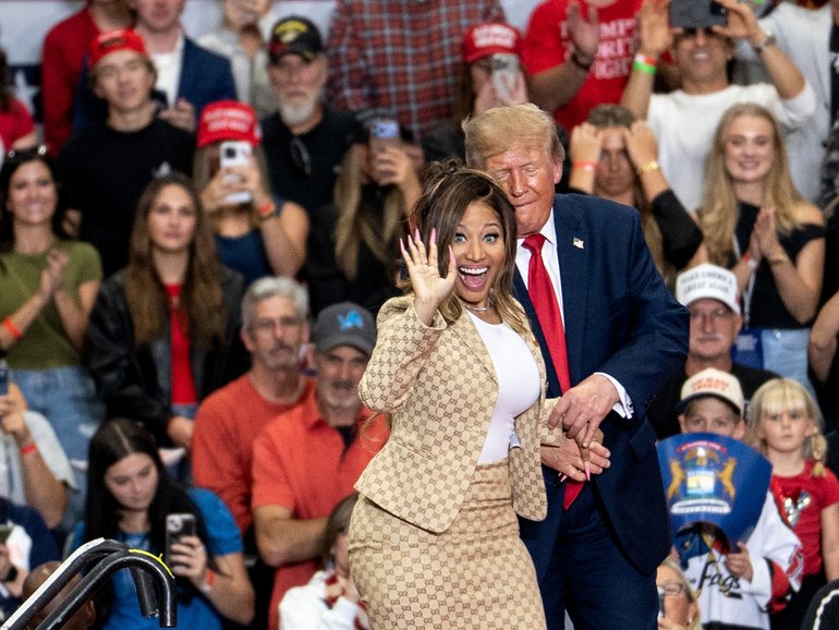 US President Donald Trump greets rapper Nicki Minaj during a campaign event in Port Huron.