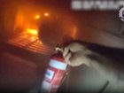 Dramatic footage shows police rushing into a smoke-filled Queensland home to rescue a woman.