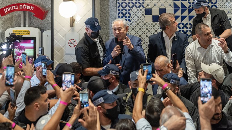 Benjamin Netanyahu, Israel’s prime minister, speaks to supporters in the food court of a shopping mall in Holon, Israel, during a campaign visit, on October 13, 2026. 