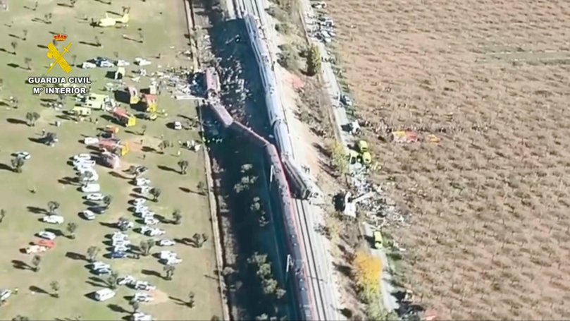An aerial view of carriages and first responders on the site.