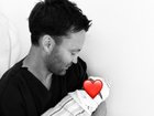 An AFL legend has shared a surprise baby announcement after keeping his partner’s pregnancy a secret.