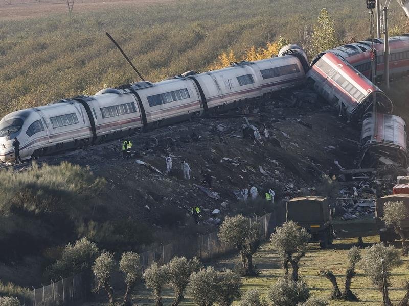 Search-and-rescue efforts continued into the night after a horrific train collision in Spain. (EPA PHOTO)