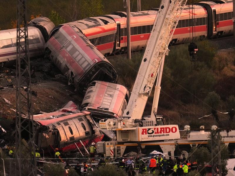 Search-and-rescue efforts continued into the night after a horrific train collision in Spain. (AP PHOTO)