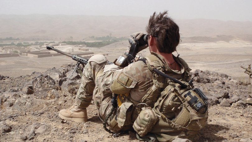 SAS Trooper Andy White in Shah Wali Kot, Afghanistan, with a sniper rifle and binoculars the day after Jason Brown was killed.