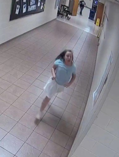 CCTV footage shows Adrian running down the hallway to the nurse's office as she continued choking.